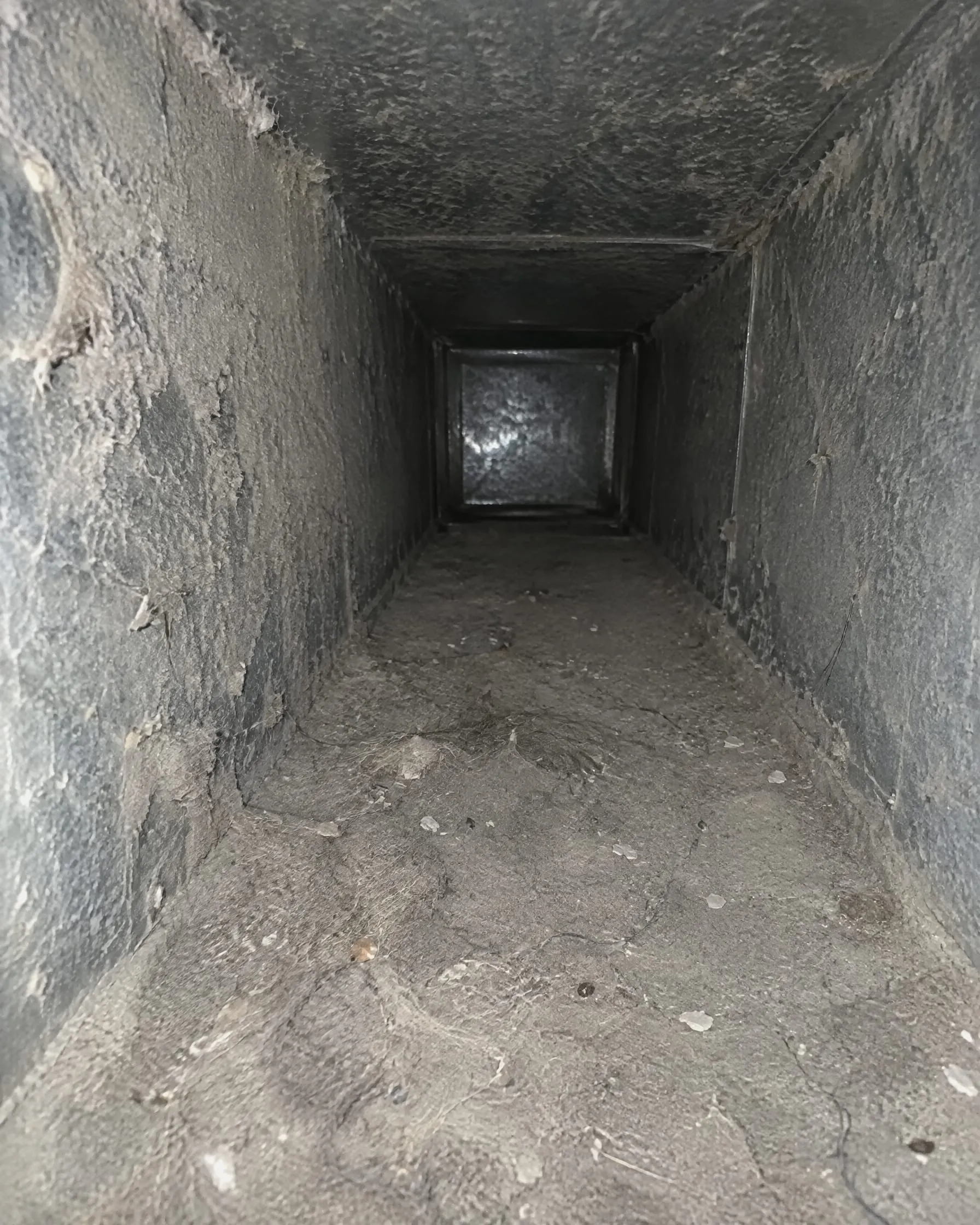 Example: dusty air duct trunk line before cleaning